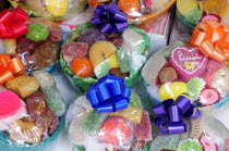 Mexico, Puebla, Packages of brightly coloured sweets.