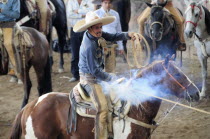 Mexico, Bajio, Zacatecas, Traditional horsemen or Charros competing in Mexican rodeo.