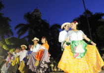 Mexico, Veracruz, Folkloric dancers in the Zocalo at night.
