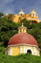 Mexico, Puebla, Cholula, Church of Neustra Senor de los Remedios on tree covered hillside above the pyramid ruins.