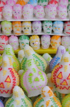 Mexico, Puebla, Sugar candies shaped as skulls and lanterns for Dia de los Muertos or Day of the Dead festivities.