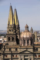 Mexico, Jalisco, Guadalajara, Cathedral, part view of exterior facade, roof dome and spires.