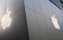 Japan, Tokyo, Ginza, Chuo-dori Ave , part of the facade of the new Apple Computer store featuring the Apple logo. **Editorial Use Only**