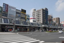 Japan, Tokyo, Sugamo, the roof of arcade covering sidewalk used for solar electric and water heating panels.