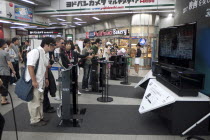 Japan, Tokyo, Sony 3D televisions being demonstrated in shopping mall.