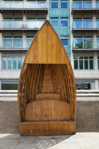 England, London, Vauxhall, Albert embankment, benches made from wood in the shape of boats.