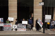 England, London, Westminster, Protesters campaigning outside the Houses of Parliament.