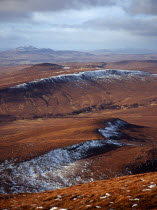 Scotland, Highlands, North, View north west from Ben Griam Mhor Mountain at 590 metres with snow capped ridges facing north east.
