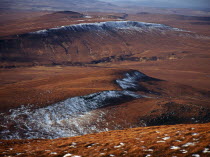 Scotland, Highlands, North, View north west from Ben Griam Mhor Mountain at 590 metres with snow capped ridges facing north east.