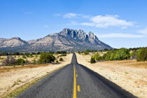 USA, Texas, country road toward mountain near Fort Davis.