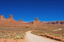 USA, Utah, winding dirt road through the Valley of the Gods.