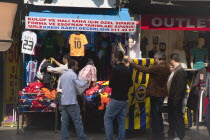 Turkey, Istanbul, Eminonu, Shop selling football shirts.