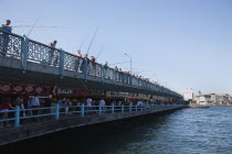 Turkey, Istanbul, Galata Bridge, people fishing.