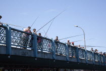 Turkey, Istanbul, Galata Bridge, people fishing.