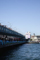 Turkey, Istanbul, Galata Bridge, people fishing.