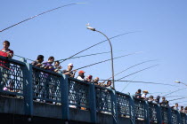 Turkey, Istanbul, Galata Bridge, people fishing.