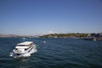 Turkey, Istanbul, Galata Bridge with ferry approaching to pass under.