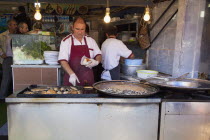 Turkey, Istanbul, Karakoy, Galata fish market, stall selling fried fish snacks.