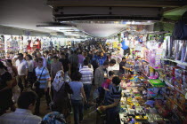 Turkey, Istanbul, Eminonu, busy subway with stall selling childrens toys.