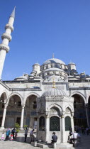 Turkey, Istanbul, Eminonu, Yeni Camii, New Mosque, worshippers washing feet in courtyard.