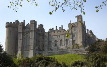 England, West Sussex, Arundel Castle seen from the river bank.