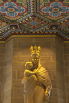 England, West Sussex, Shoreham-by-Sea, Lancing College Chapel interior, statue of the Virgin Mary holding the Baby Jesus.