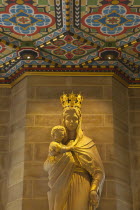 England, West Sussex, Shoreham-by-Sea, Lancing College Chapel interior, statue of the Virgin Mary holding the Baby Jesus.