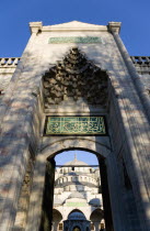 Turkey, Istanbul, Sultanahmet Camii, The Blue Mosque Courtyard and minaret seen through the exit to the Hippodrome.