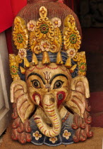 Nepal, Kathmandu, Colorful cultural masks made of papier mache in the form of lord Ganesh.