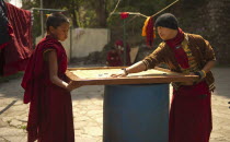 India, Sikkim, Buddhist monks playing carrom.