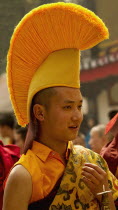 India, Sikkim, Buddhist  monk in a Losar procession.