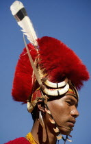 India, Nagaland, Naga Warrior tribal in traditional costume and head dress. 