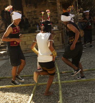 India, Nagaland, Naga Warrior tribe performing bamboo dance.