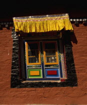 India, Sikkim, Art in monastery architecture, colorful windows.