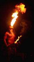Singapore, Fire Eating performance by tribal man from Sarawak.
