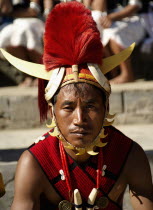 India, Nagaland, Naga Warrior tribal in traditional costume and head dress. 