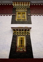 India, Sikkim, hand crafted and painted windows in Buddhist monastery.