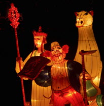 Singapore, Chinese mid-autumn harvest festival is celebrated by lighting lanterns and eating mooncakes. These large silk lanterns depicting various scenes of Chinese mythology light up the river.