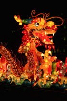 Singapore,  Chinese mid-autumn harvest festival is celebrated by lighting lanterns and eating mooncakes. These large silk lanterns depicting various scenes of Chinese mythology light up the river.