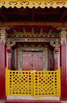 India, Sikkim, hand crafted and painted door in Buddhist Monastery.