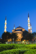 Turkey, Istanbul, Sultanahmet Camii, The Blue Mosque domes and minarets at sunset with son et lumiere light show.