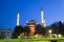 Turkey, Istanbul, Sultanahmet Camii, The Blue Mosque domes and minarets at sunset with son et lumiere light show.