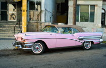 Cubam Havana, Pink Buick  convertile with the roof raised.