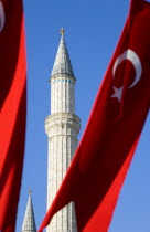 Turkey, Istanbul, Sultanahmet, Haghia Sophia minaret and Turkish red flag with white crescent moon and star.