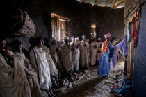 Ethiopia, service inside rural mud built rural Christian church.