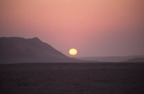 Namibia, sunset in the Namib Naukluft desert.  Access is restricted due to Diamond mining activity by DeBeers.