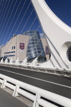 Ireland, County Dublin, Dublin City, North Wall Quay, CCD convention centre, designed by architect Kevin Roche, seen through the Samuel Beckett bride..
