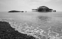 England, East Sussex, Brighton, ruins of the burnt out West Pier fallen into the sea.
