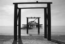 England, East Sussex, Brighton, ruins of the burnt out West Pier fallen into the sea.