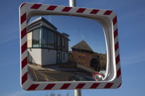 Transport, Road, Safety, Convex mirror used to view oncoming traffic from unsighted exit.